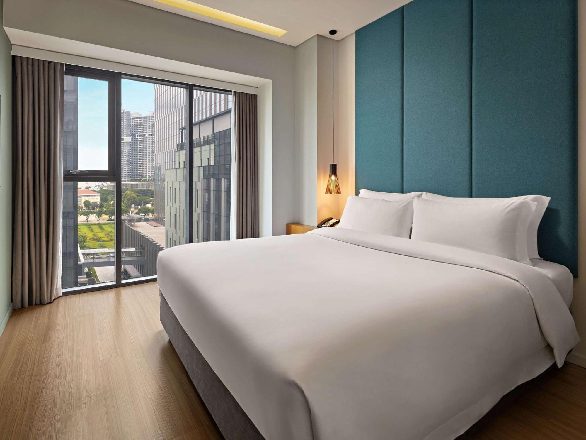 הו צ'י מין סיטי Novotel Living Saigon South מראה חיצוני תמונה